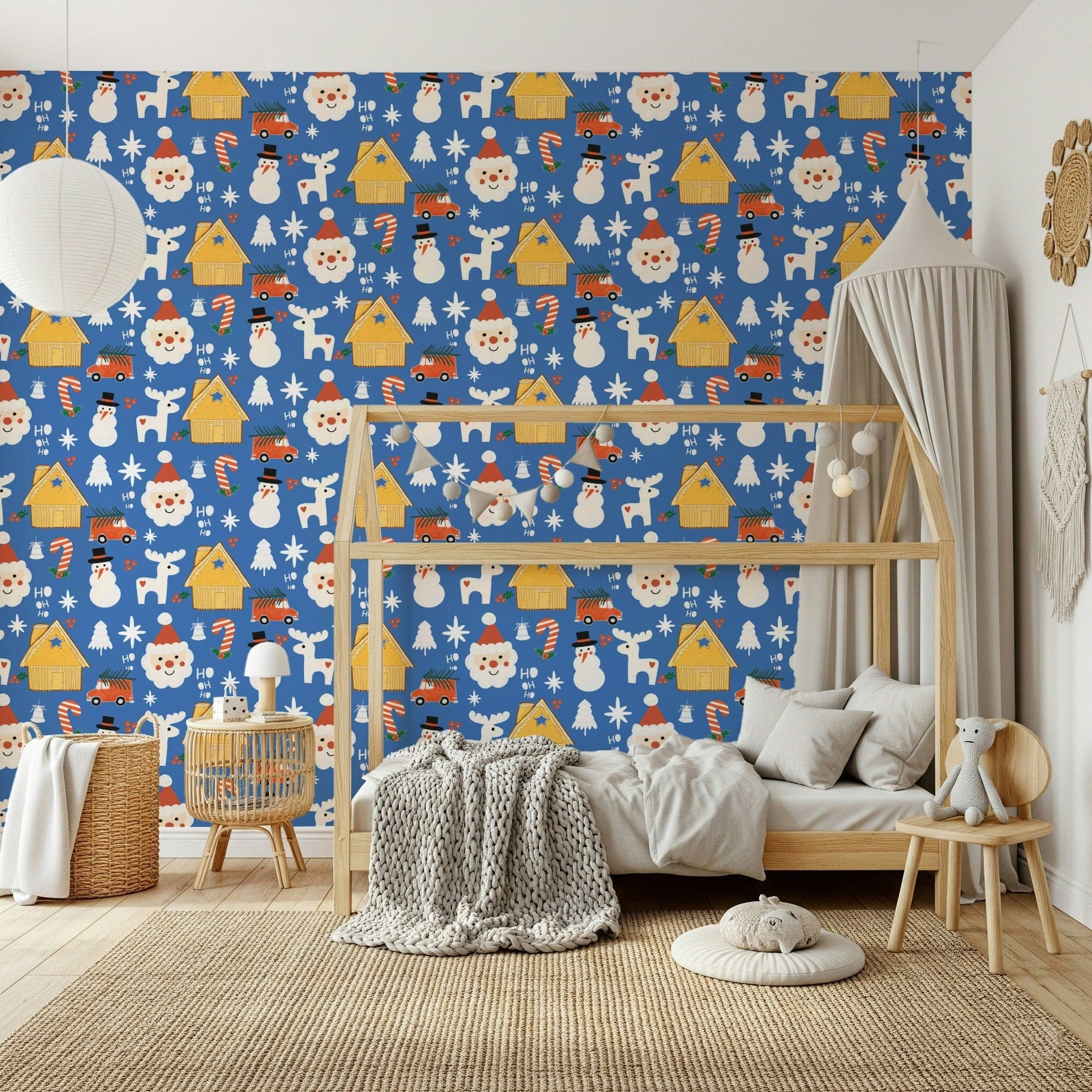 Bright blue holiday wallpaper featuring cheerful doodle Santas, snowmen, trees, and reindeer.