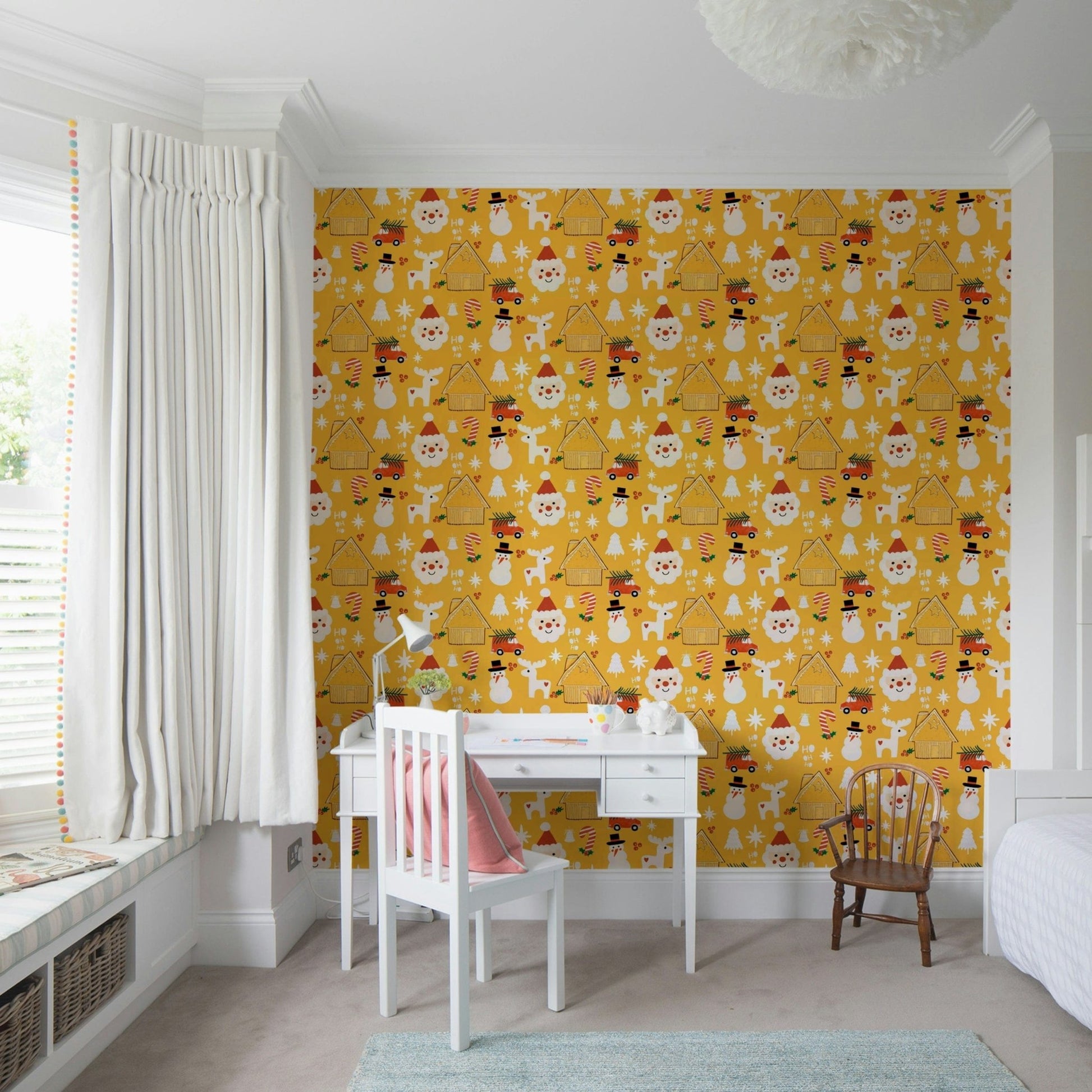 Cute Christmas motifs—including reindeer, cottages, and snowmen—create a joyful pattern on this yellow holiday wallpaper.
