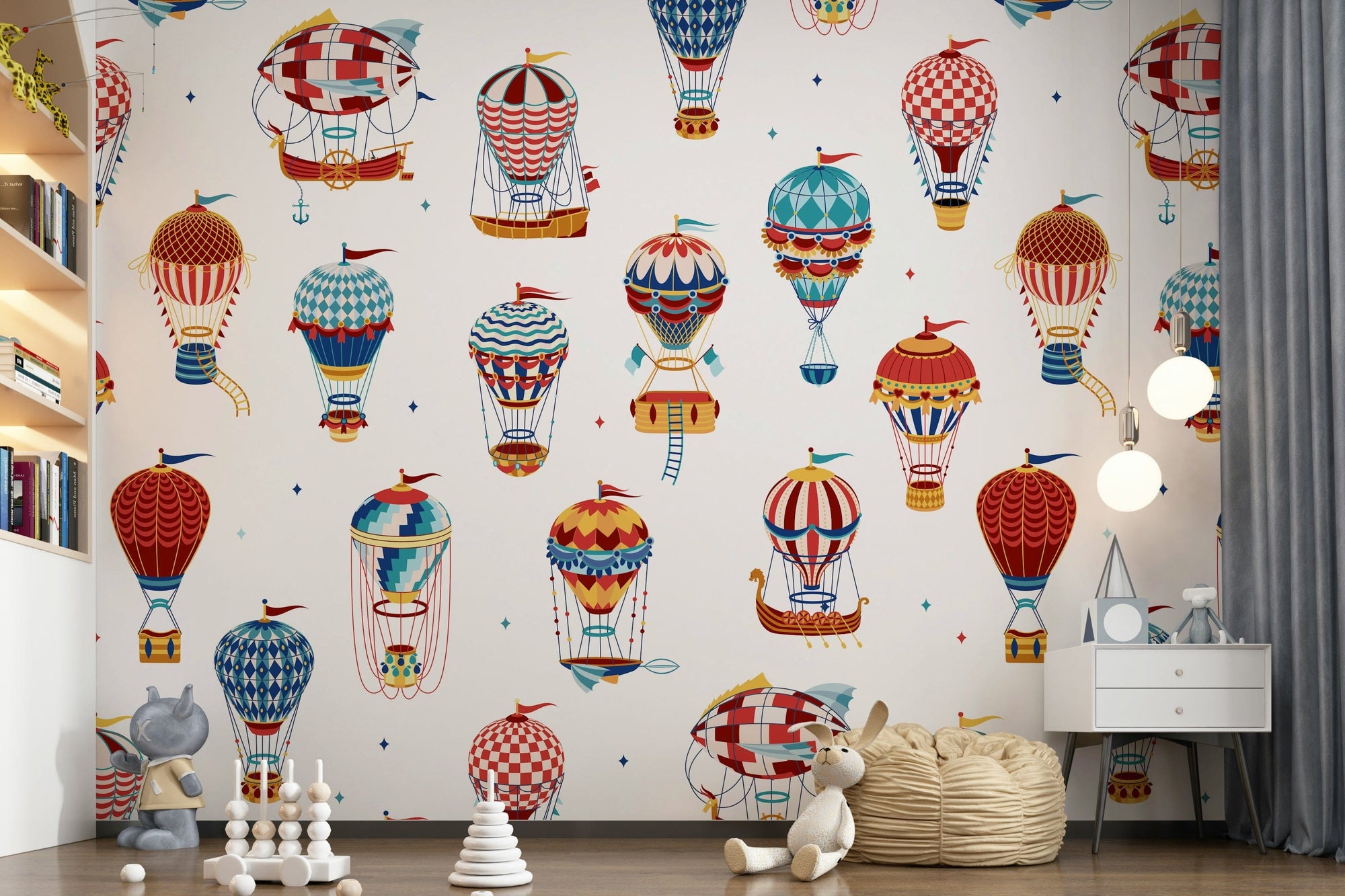 Up, Up and Away wallpaper mural of vintage red and blue hot air balloons on cream in a kids room with bookshelf and bean bag