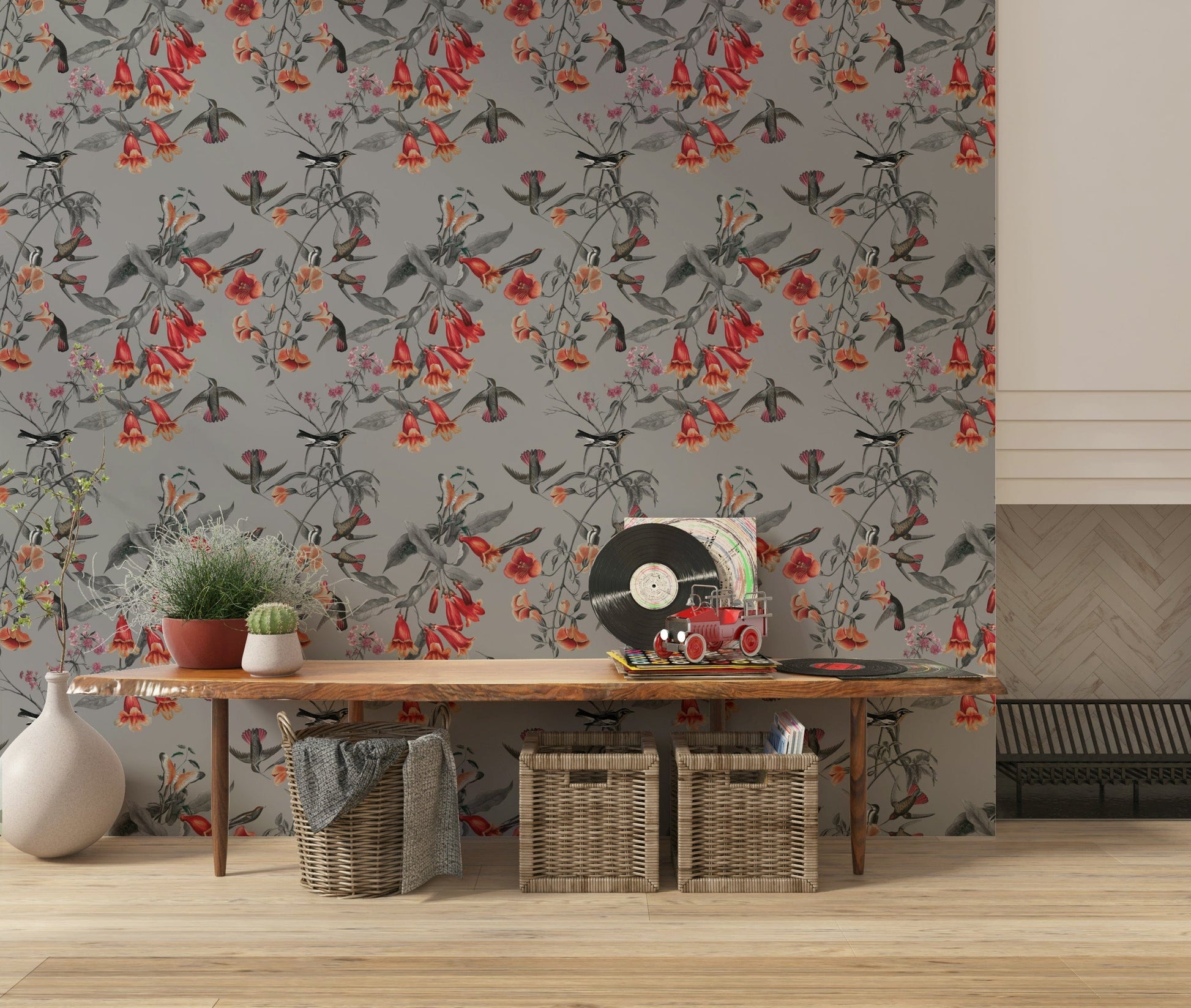 Subtle floral patterns on a landscape wallpaper for a living area.