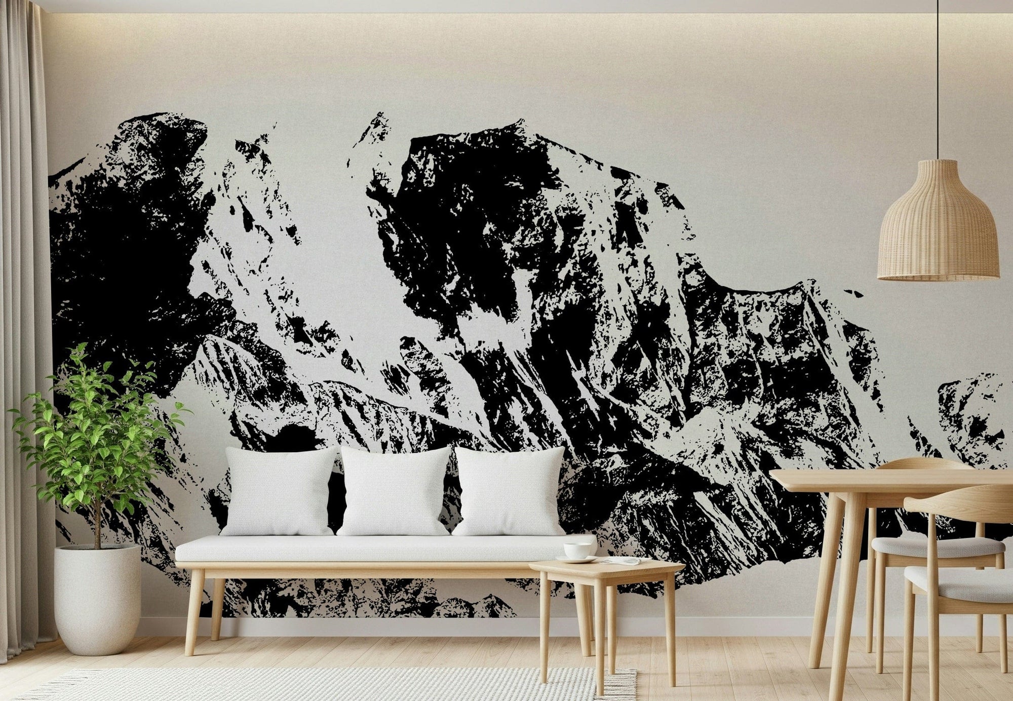 Ink Mountain Ascent wallpaper mural in black and white behind a wood bench with white pillows in a living room