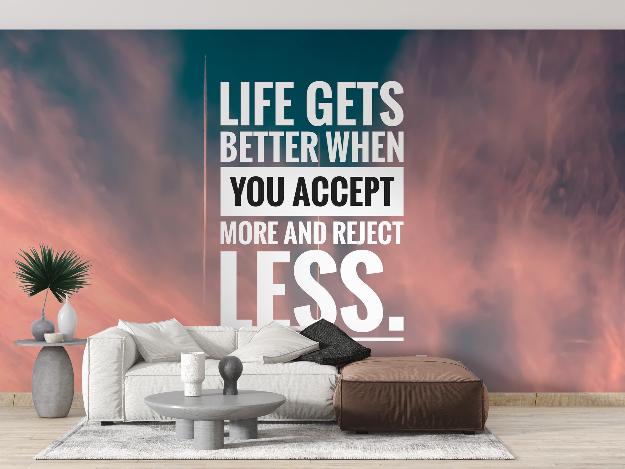 Inspirational Acceptance Quote wallpaper mural on pink and teal sky behind a white sofa and brown leather pouf in a living room