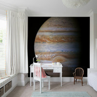 Large Jupiter wallpaper on staircase wall, modern interior, bold planet focus