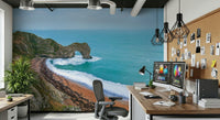 Sandy beach and rock formation mural behind a grey sofa