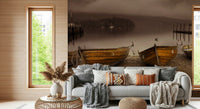 Rustic lakeside wallpaper with weathered wooden boats and a peaceful sepia landscape.