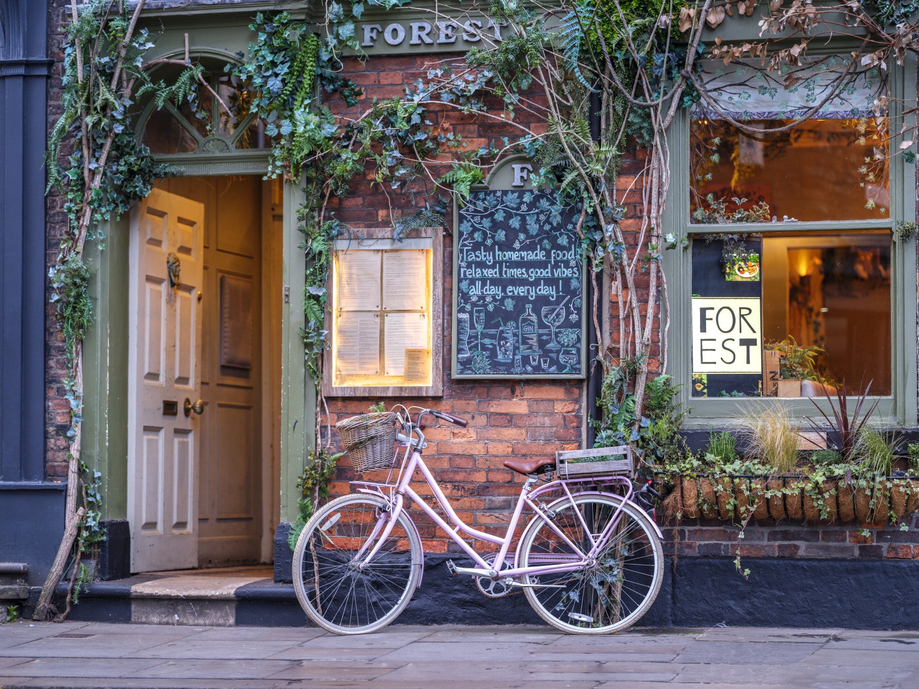 Bicycle outside a cafe Wall Mural