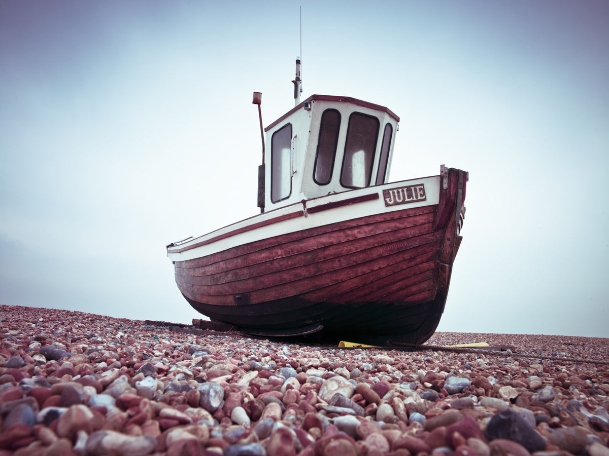 Boat Resting on Pebbled Strand Wall Mural