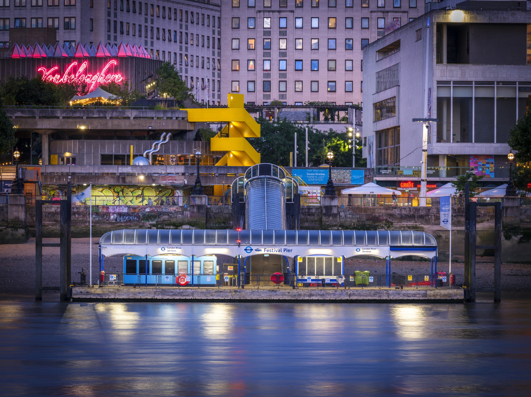 Southbank night wall mural with glowing riverside city lights
