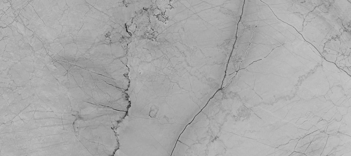 Papier peint panoramique en pierre veinée monochrome