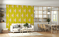 Patterned yellow wall mural enhances sofa backdrop