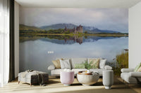 There are some tree branches in the water in the foreground.

