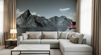 Atmospheric Nordic mural showing a red house overlooking dramatic mountains and calm waters.