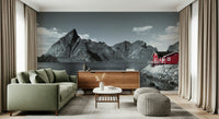 Wall mural depicting rugged fjord cliffs and a bright red waterfront home against a serene lake.