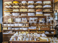 London cheese shop interior mural for bedroom accent wall, calm neutrals, cozy decor