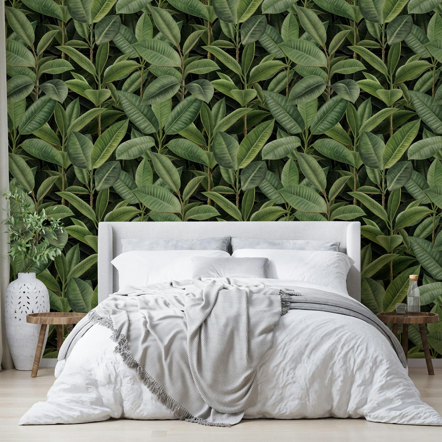 A wallpaper with a repeating pattern of rubber tree leaves and other tropical foliage.
