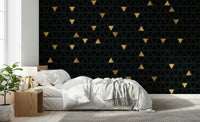 Luxury Black and Gold Triangles Wall Mural installed in a chic living room, showcasing its bold, modern wallpaper design.
