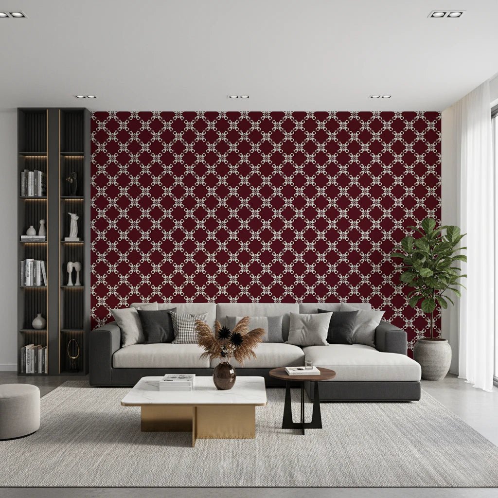 Maroon Lattice wallpaper in burgundy and cream behind a grey sofa with a black bookshelf and marble coffee table in a living room