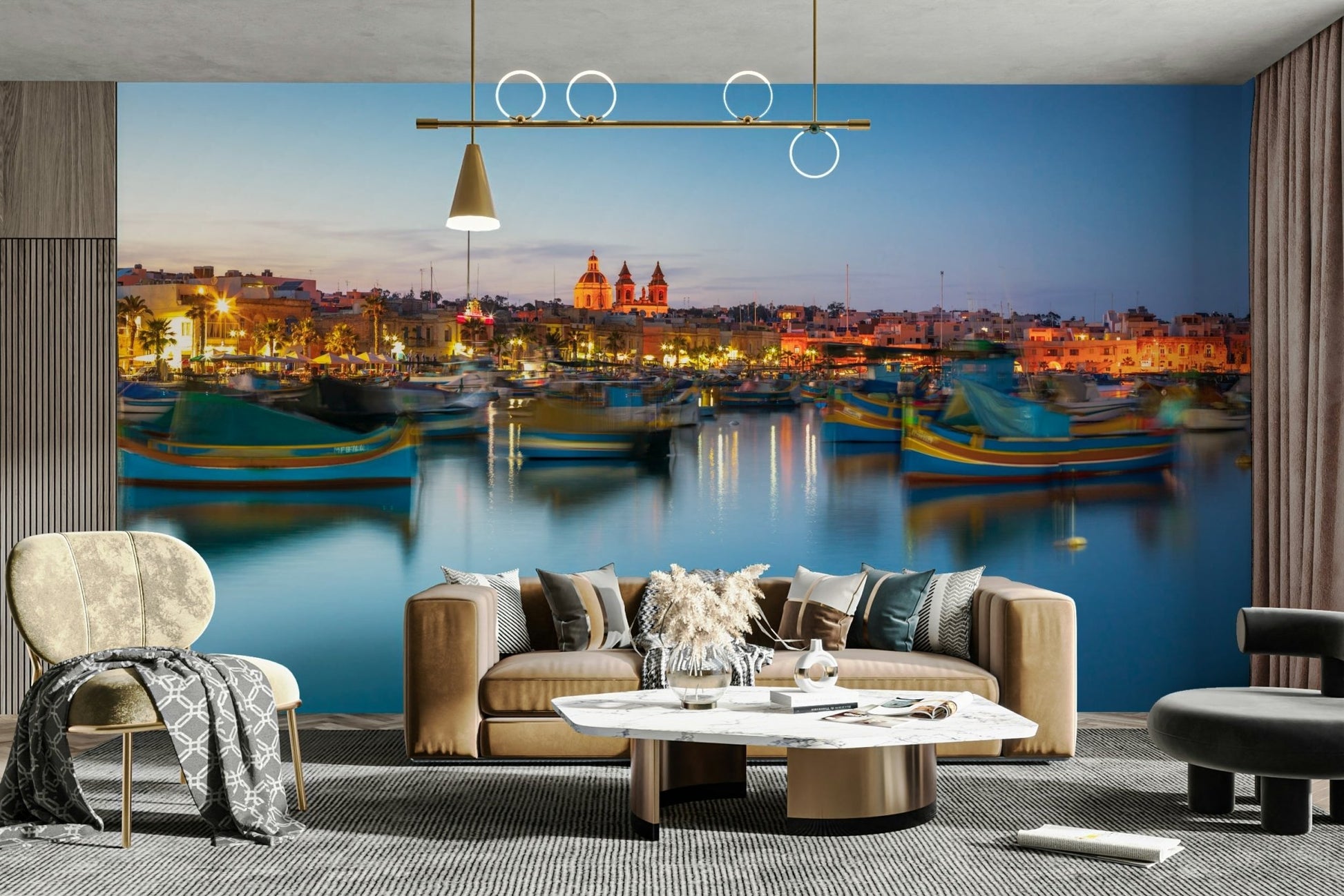 The calm water reflects the lights of the town.

