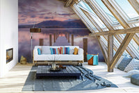 A bedroom with the coastal mural behind the headboard.

