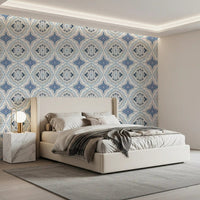 Mediterranean indigo fleur tile wallpaper used for a bedroom feature wall.