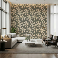 Geometric mid-century floral wallpaper with radiating petal shapes on a textured green backdrop.