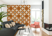 A mid-century charm wallpaper featuring bold circular motifs with retro leaf accents in warm orange tones.