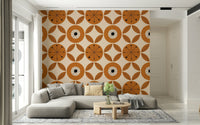 Vintage-inspired wallpaper with repeating orange geometric circles and stylized leaf patterns.