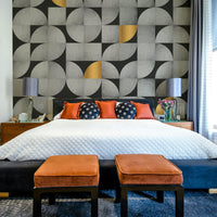 Mid-century inspired concrete mural with gold highlights

