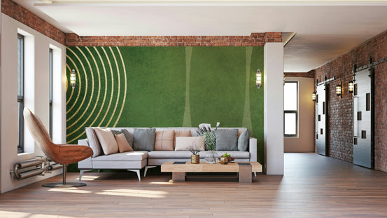 Mid Century Modern Green wallpaper mural with gold arches behind a grey sectional sofa in a brick loft living room