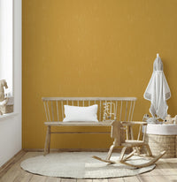 Contemporary textured wallcovering with a distressed retro mustard finish.