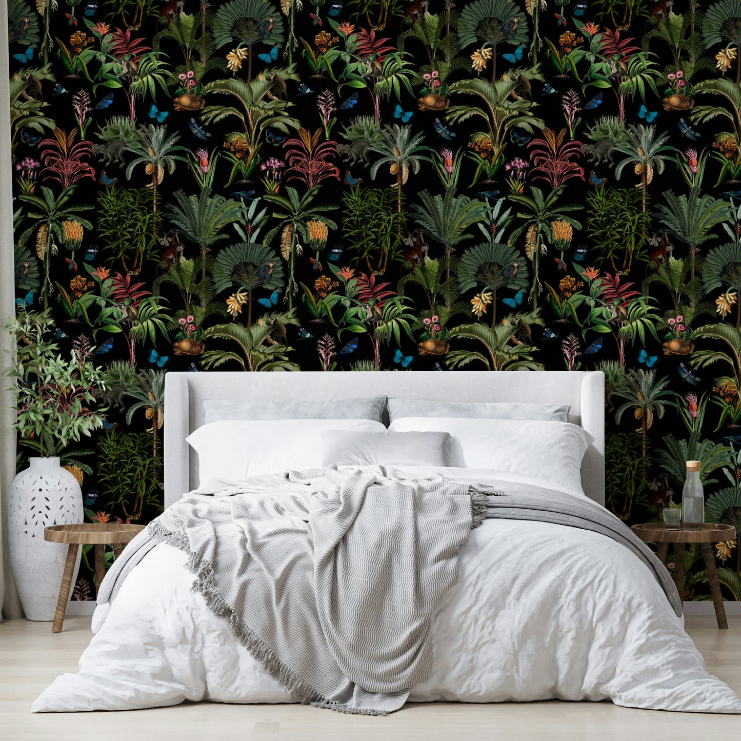 Bold tropical wallpaper with lush plants and rich midnight hues.

