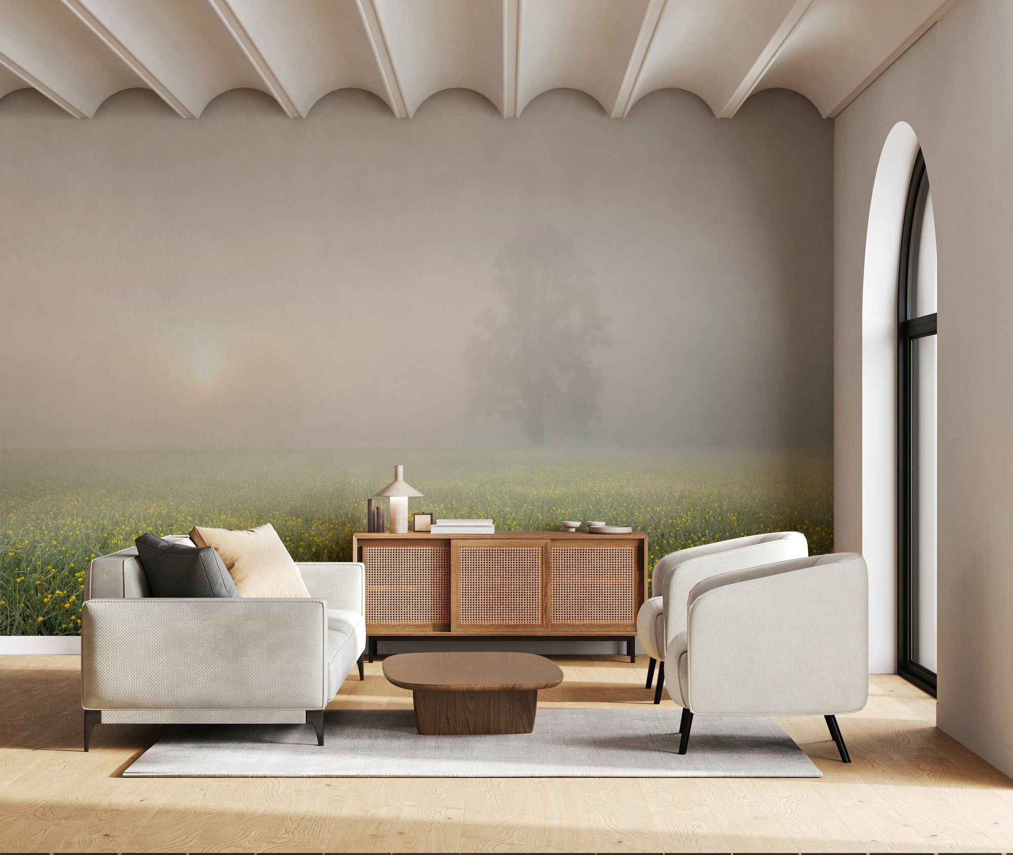 Misty Meadow Bloom wallpaper mural of a foggy wildflower field behind a gray sofa and cane credenza in a living room