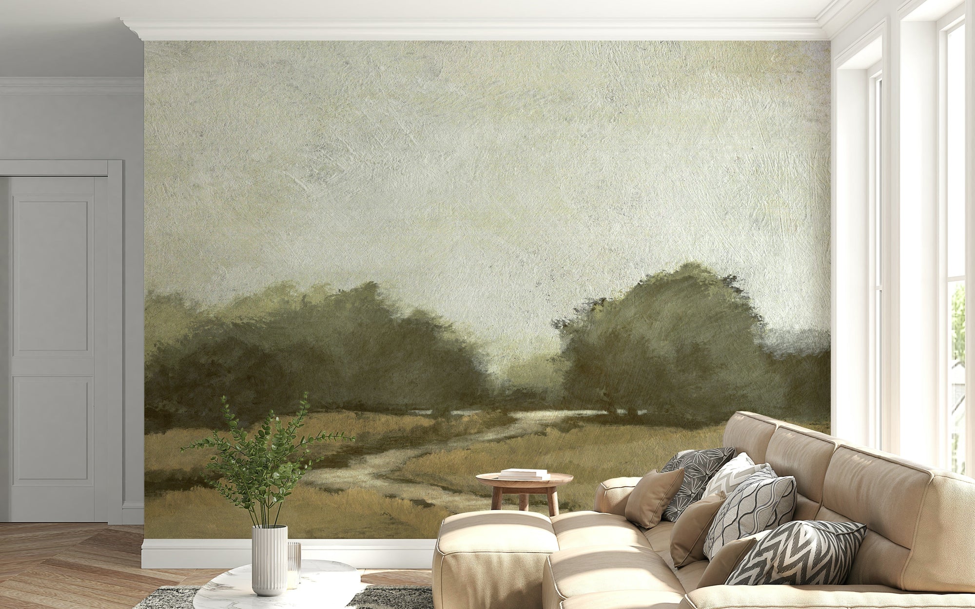 Misty Path wallpaper mural with golden meadow and olive trees behind a beige sectional sofa in a living room