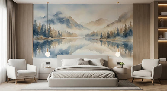 Misty Peaks wallpaper mural of a foggy mountain lake with pine reflections behind a bed flanked by cream armchairs