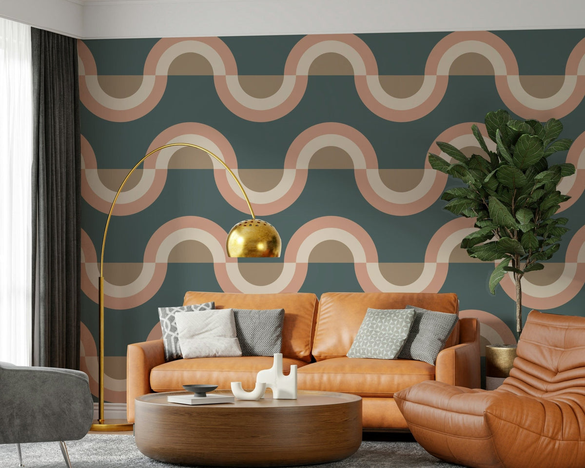 Modern Retro Arcs Decor wallpaper mural in teal with peach waves behind a tan leather sofa and gold arc lamp in a living room