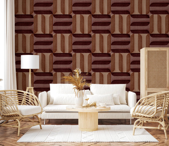 Modern Textured Signs Clay wallpaper in rust and burgundy geometric shapes behind a white sofa flanked by rattan armchairs in a living room