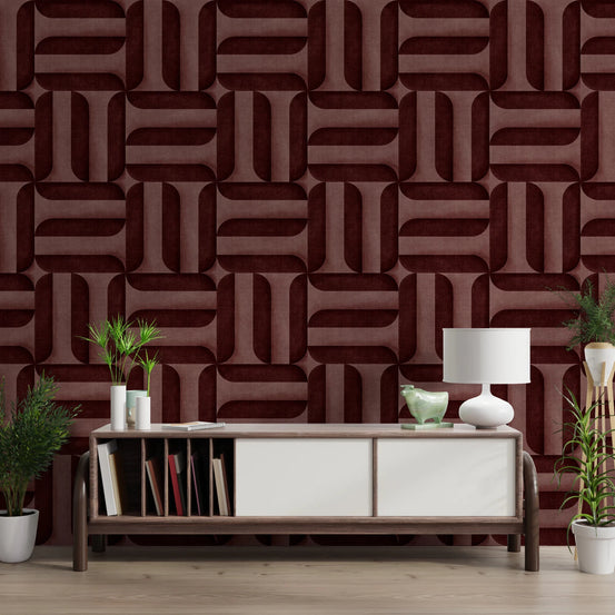 Modern Textured Signs Wine wallpaper in burgundy geometric shapes behind a wood and white sideboard with books in a living room