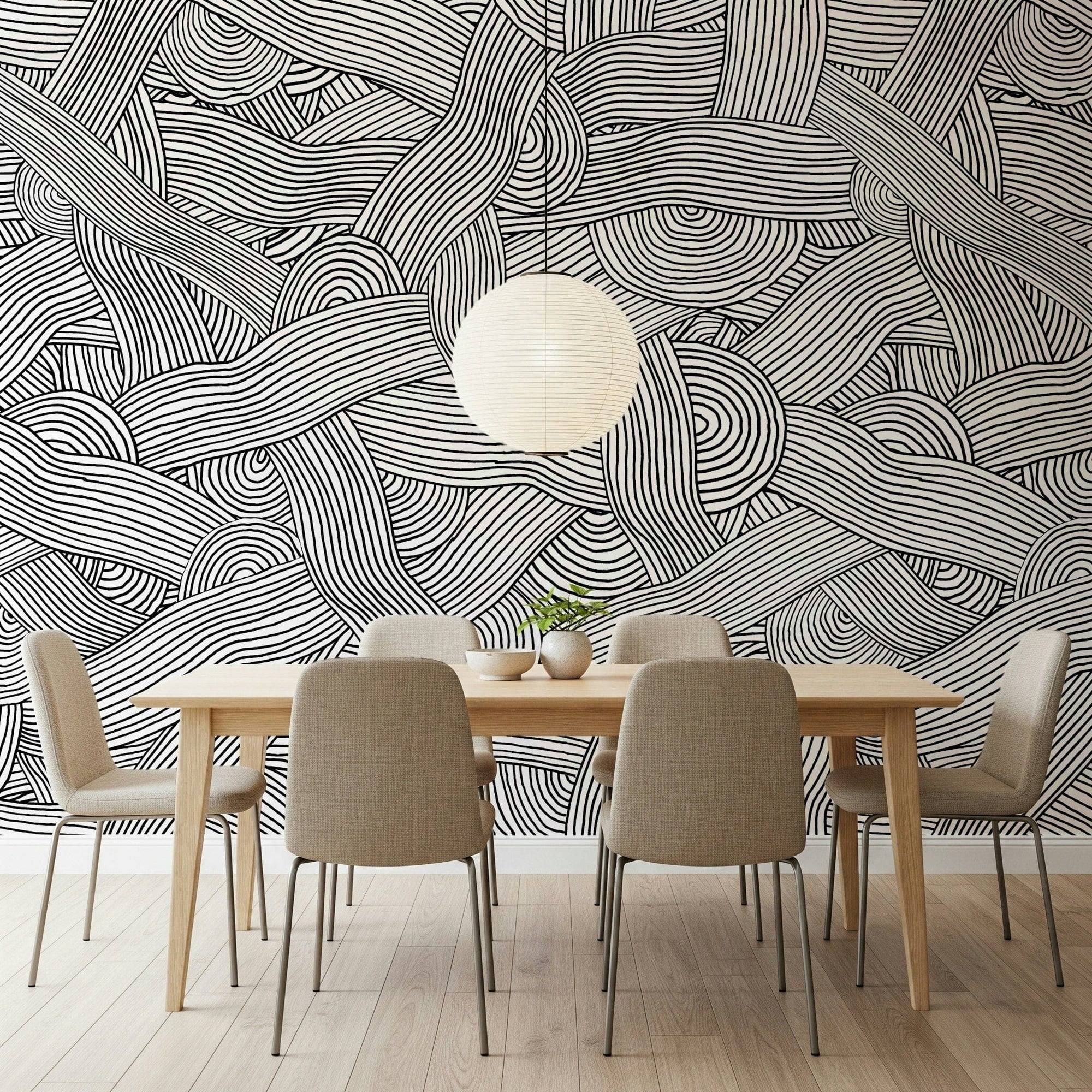 Monochromatic Striped Maze wall mural in black and white above a wood dining table in a dining room