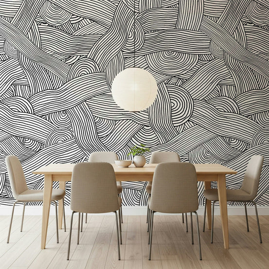 Monochromatic Striped Maze wall mural in black and white above a wood dining table in a dining room