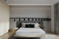 A wall mural of a bridge in a monochrome color scheme.

