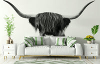 Black‑and‑white close‑up of Highland cow face and horns mural

