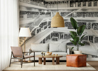Wall mural with monochrome library shelves creating a stylish, sophisticated interior.