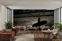 A close-up of the ocean water hitting the rugged rocks.

