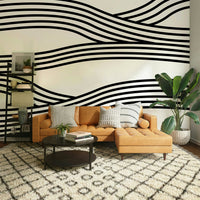 Minimalistic monochrome wave mural adding a modern touch.


