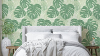 Monstera Moments Wallpaper featuring vibrant monstera leaves.

