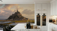 Wallpaper depicting the historic Mont Saint-Michel with glowing morning skies.