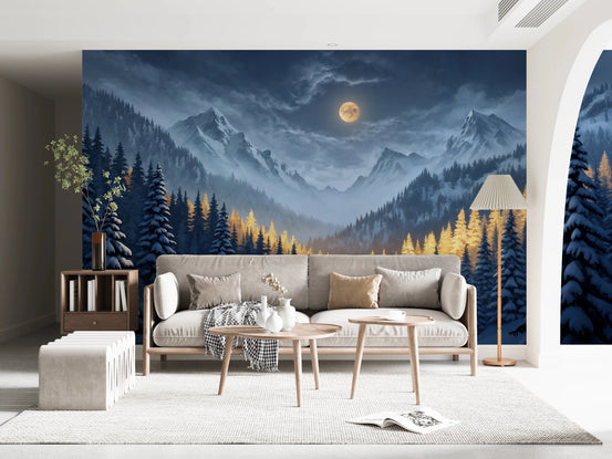 Moonlit Winterscape wallpaper mural of a golden moon over snowy mountains above a cream sofa in a living room