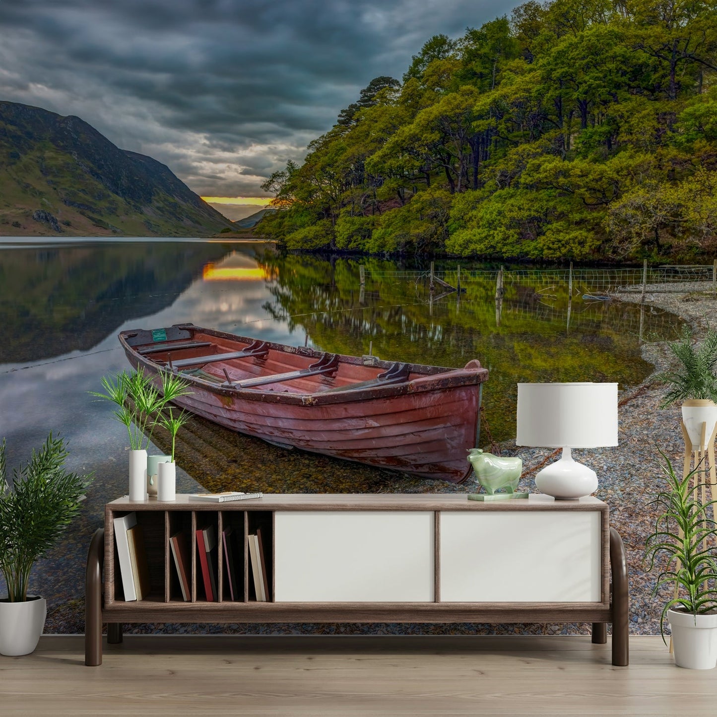 The image shows a small, red rowboat moored at the edge of the water.

