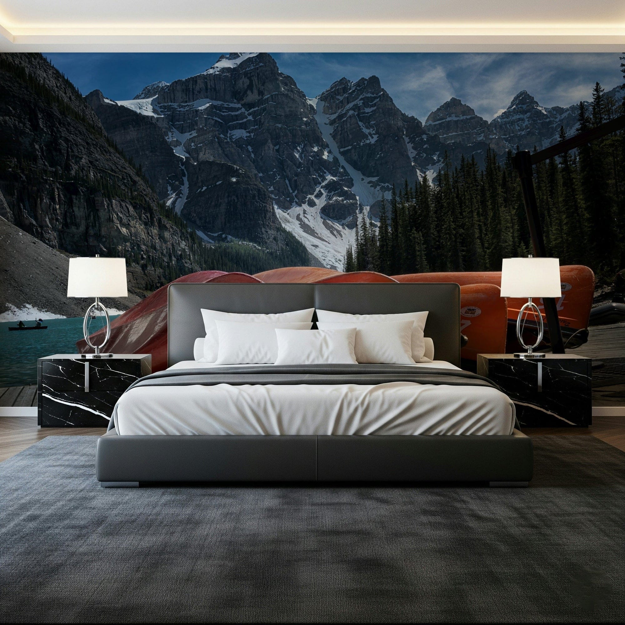 Moraine Lake Canoes wallpaper mural of red canoes and snowy peaks behind a grey platform bed in a bedroom