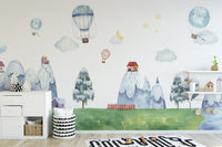 Children's wallpaper with whimsical mountains and homes
